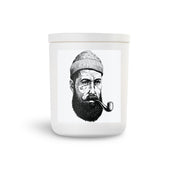 nautical salty sailor pirate scented soy candle.  Cool pirate with tatoo on side of his face.  White vessel