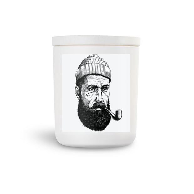 nautical salty sailor pirate scented soy candle.  Cool pirate with tatoo on side of his face.  White vessel